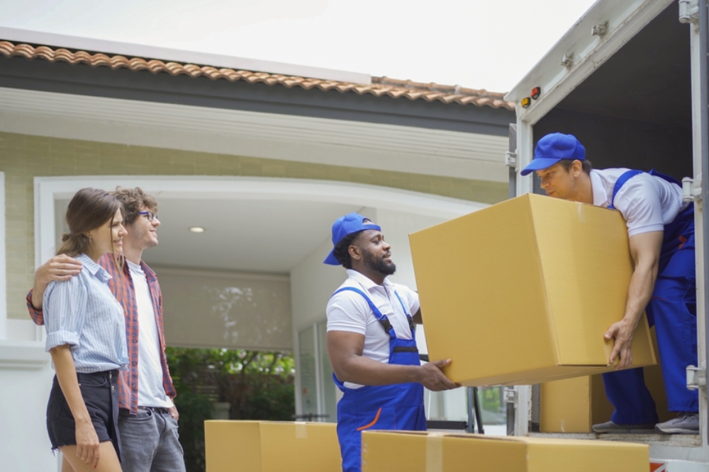 Two Movers lifting a box